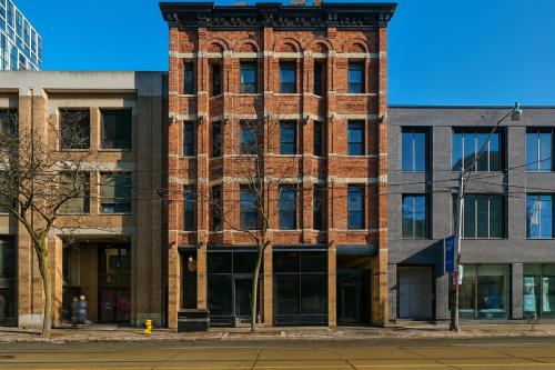 a tall brick building on a city street at Nester Finn St Lawrence Market in Toronto