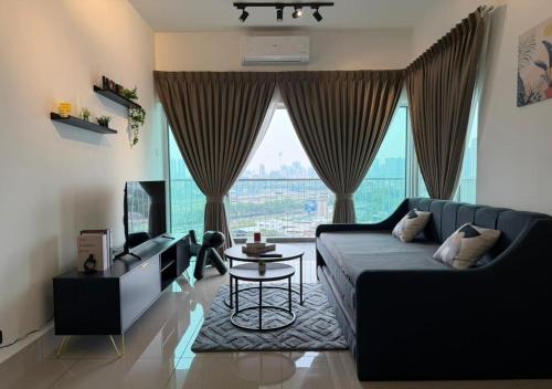 a living room with a couch and a table at K&L Suites Razak City Kuala Lumpur in Kuala Lumpur