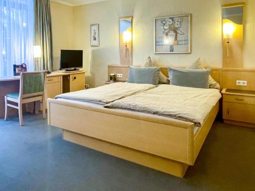 Gulta vai gultas numurā naktsmītnē Hotel Dreyer Garni