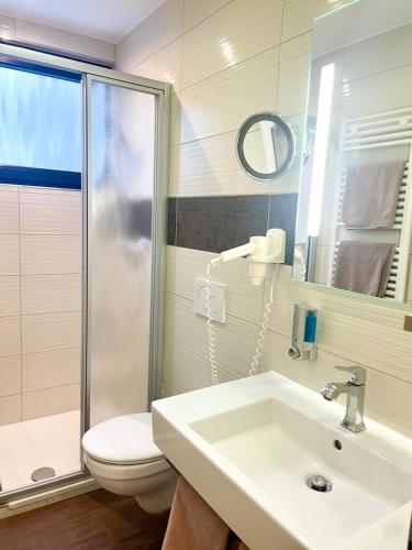 Vannas istaba naktsmītnē Hotel Dreyer Garni