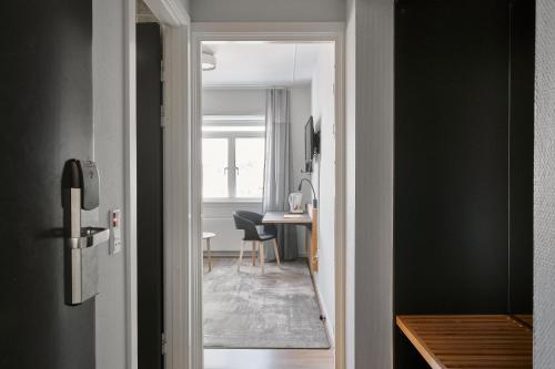a hallway leading to a dining room with a table at Hotel Svendborg in Svendborg