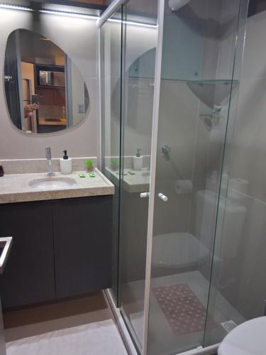 a bathroom with a shower and a sink at Flat Beach Haus a beira mar João pessoa in João Pessoa