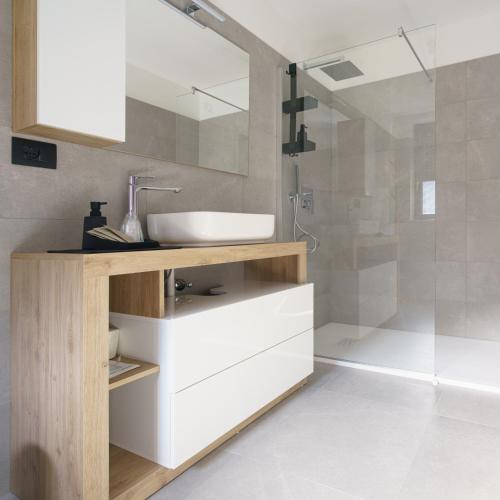 a bathroom with a sink and a shower at CT Executive Rooms, Lake Como and Valtellina in Dubino
