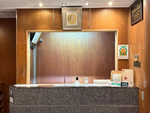 a bathroom with a large mirror and a counter at Tazuru in Kyoto