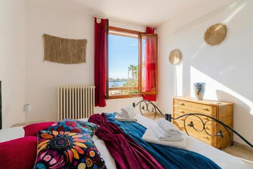 a bedroom with a bed and a window at Casa Stella Otranto Centre - Sea View, AC & WiFi in Otranto