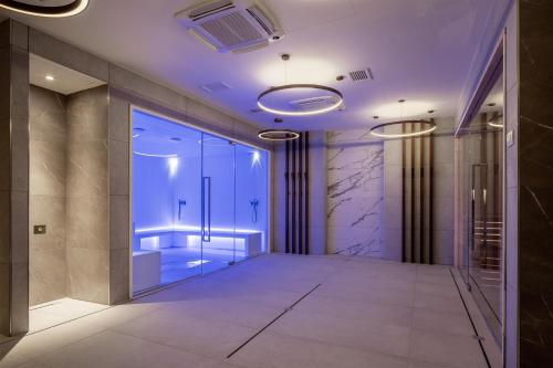 a hallway with a walk in shower in a building at Radisson Blu Hotel, Florence in Florence
