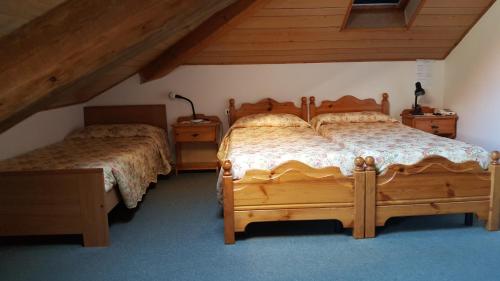 Postel nebo postele na pokoji v ubytování Hotel Romanda