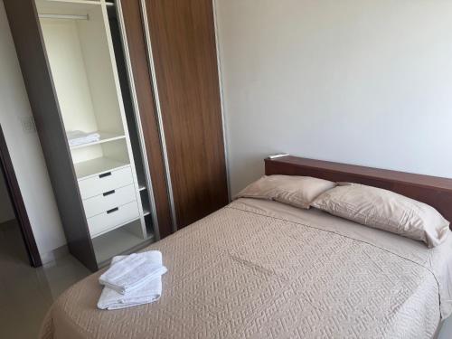 Llit o llits en una habitació de Edificio Mirador las Américas