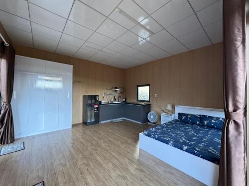 a large room with a bed and a kitchen at Sen Đá Home 2 in Da Lat