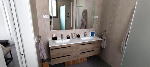 a bathroom with a sink and a mirror at Villa Mojacar in Mojácar