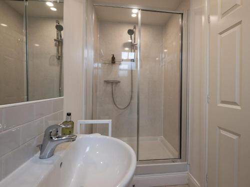 a bathroom with a shower and a sink and a shower at 3 Bed in Belford oc-89518 in Belford