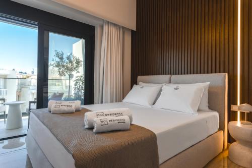 Llit o llits en una habitació de Unique Icon Residence