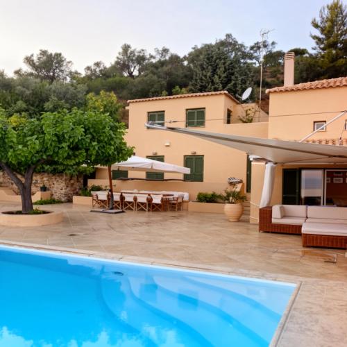a villa with a swimming pool and a house at Alpha Luxury Villa - Private Pool & VIP Services in Platanias