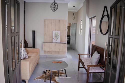 a living room with a couch and a table at The Nelsons on 99 Smith in Dundee