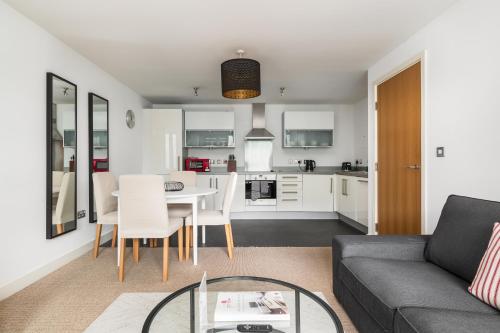 a living room with a couch and a table at City Stay Apartments - Vizion in Milton Keynes