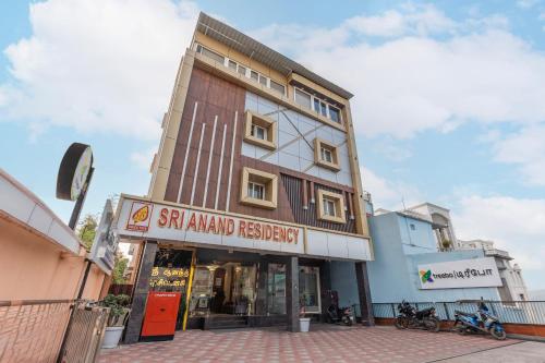 a tall building with a sign in front of it at Treebo Sri Anand Residency in Chennai