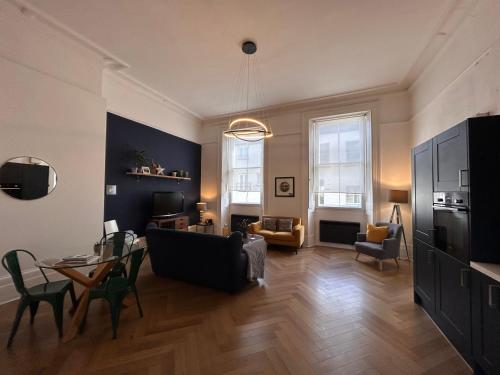 a living room with a couch and a table at 6 Wye Valley Chambers - Area of Outstanding Natural Beauty - Parking Space & Dog Friendly in Ross on Wye
