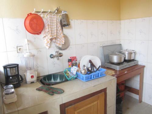 Kuchyň nebo kuchyňský kout v ubytování Appart Meublé Yaoundé Odza