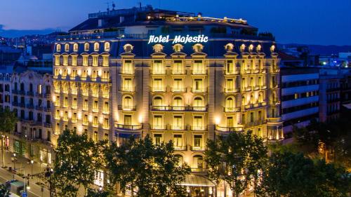 a large building with a sign on top of it at Majestic Hotel & Spa Barcelona GL in Barcelona