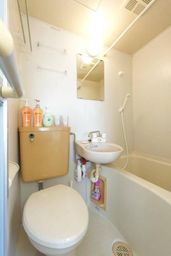 a bathroom with a toilet and a sink at sakura 601 in Tokyo
