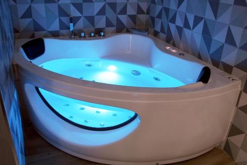 a bath tub with a smiley face painted on it at Apartamentos Las trece llaves in Mérida