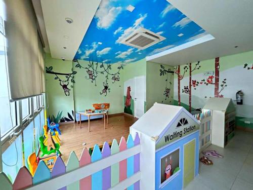 a room with a childs room with a toy house at 3ff Megaworld, One Regis in Bacolod