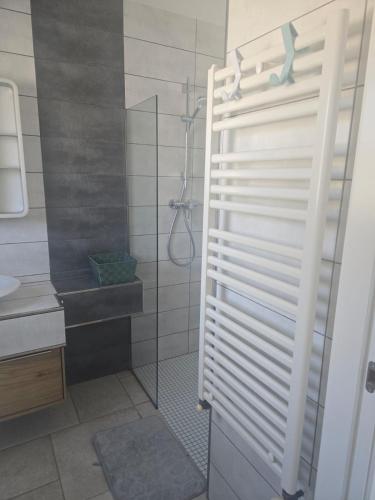 a bathroom with a shower with a glass door at Villa Good Vibes in Ifach