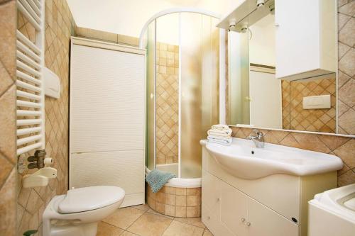 a bathroom with a white sink and a toilet at WI-RO Cavour, 48 - Tra Cielo e Mare in Marina di Andora