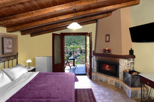 a bedroom with a bed and a fireplace at Artemis Traditional Guesthouse in Levidi