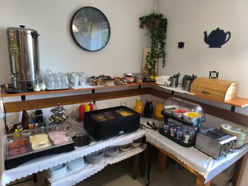 a kitchen with a counter with food on it at Penzion Jarka in Bratislava