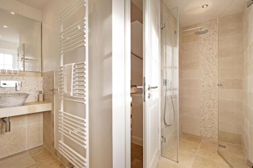 a bathroom with a shower and a sink at Listend Blick in List