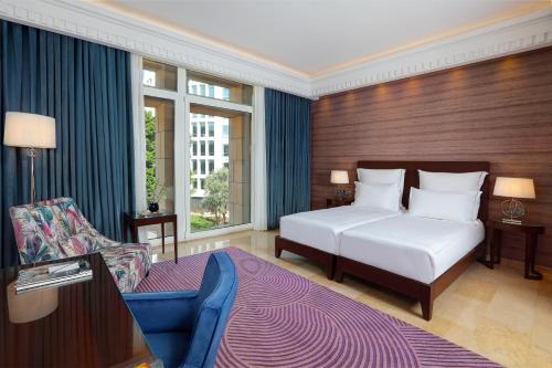 Un pat sau paturi într-o cameră la Le Gray