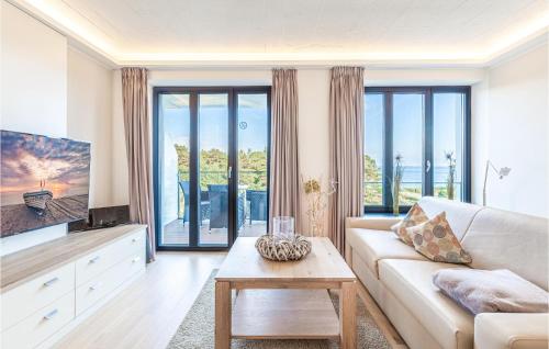 a living room with a couch and a tv at Princess in Binz