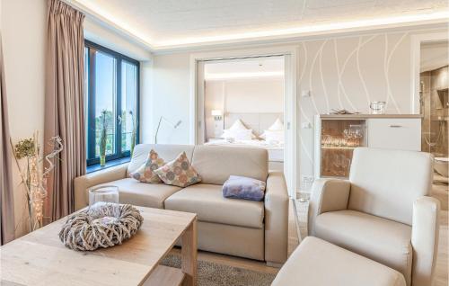 a living room with a couch and a chair at Princess in Binz