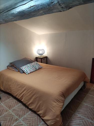 a bedroom with a large bed in a room at Appartements Cote pont Vieux-Self Check-In in Carcassonne