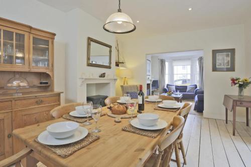 a dining room with a wooden table and chairs at 3 Bed in Southwold oc-aacait in Southwold