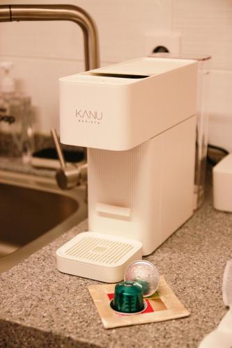 a mixer sitting on a counter next to a sink at Moonjarak Dalbit Hanok in Seoul