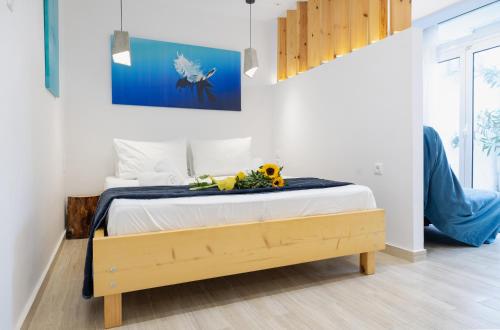 a bedroom with a bed with a stuffed animal on it at MNS Accommodations in Salamina