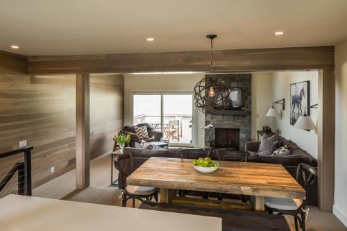 a living room with a table and a couch at Ridge 91 at Elkhorn in Elkhorn Village
