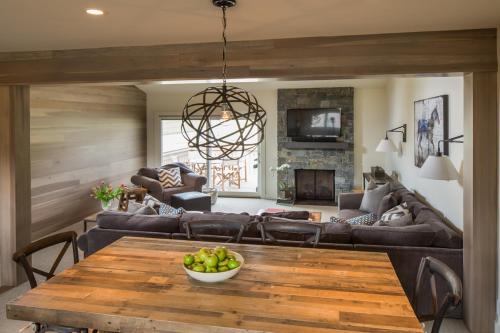 a living room with a table and a couch at Ridge 91 at Elkhorn in Elkhorn Village