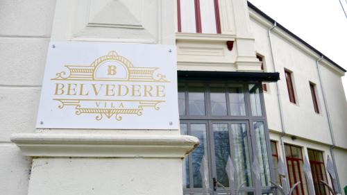 a sign on the side of a building at Vila BELVEDERE in Brăila