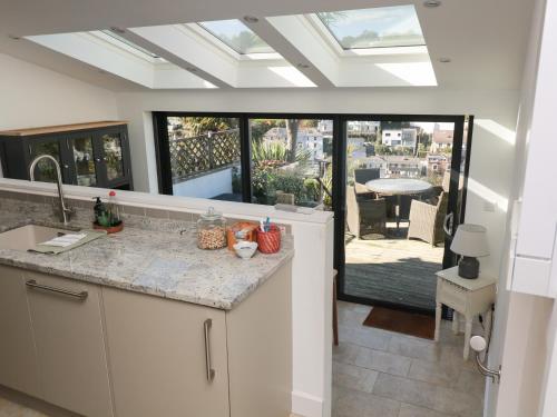 a kitchen with a counter and a view of a patio at 36 Crowthers Hill in Dartmouth