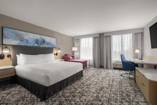 a hotel room with a bed and a desk at Hilton Garden Inn Washington DC/Greenbelt in Greenbelt
