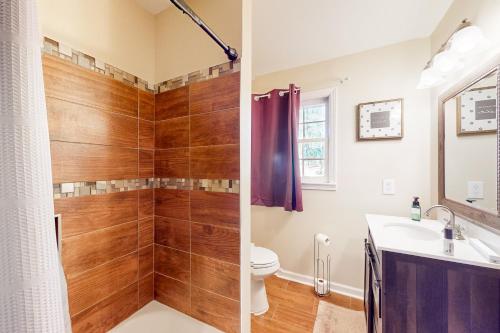 a bathroom with a shower and a toilet and a sink at 6 Mi to Dtwn: 'Macon Memories' Dog-Friendly Haven in Riverside Park