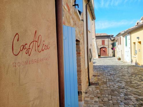 a street with a sign on the side of a building at CasAlice Room & Breakfast in Santarcangelo di Romagna