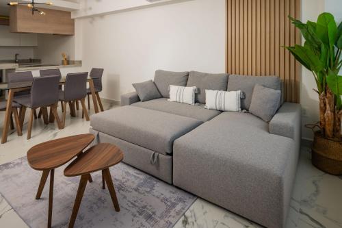 a living room with a couch and a table at Barcelona Condos Cancun in Cancún