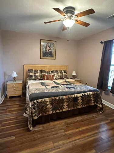 a bedroom with a bed and a ceiling fan at Mountain View Condo 3702 in Pigeon Forge