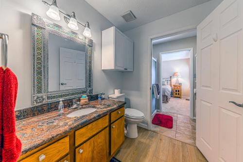 a bathroom with a sink and a toilet and a mirror at North Street Escape in Ruidoso