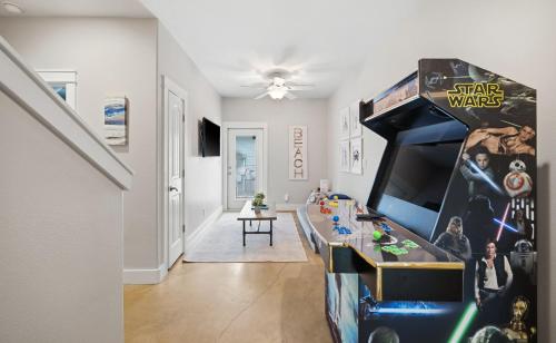 a living room with a lego star wars room at Tranquil Turtle complete with Arcade plus Pool optional Golf Cart in Port Aransas