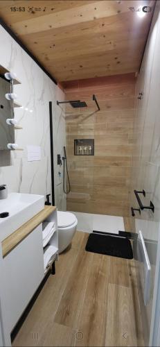a bathroom with a white toilet and a sink at Renova7io sweet home Napoli in Naples